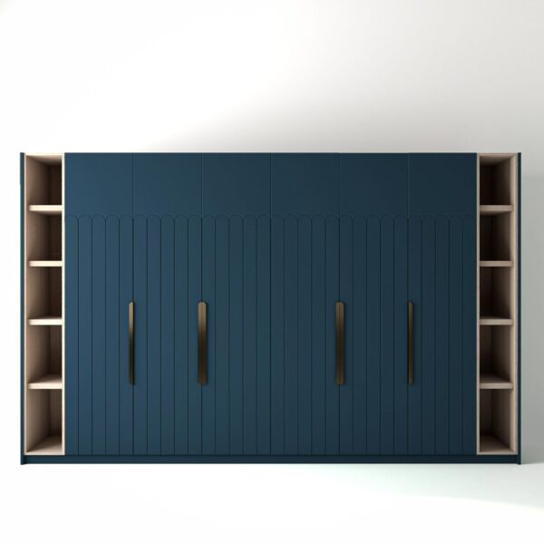 3.6 metre blue coloured freestanding wardrobe by On-Trend Wardrobes, with geo-deco door design and slim open oak shelving to each end, in a white studio setting